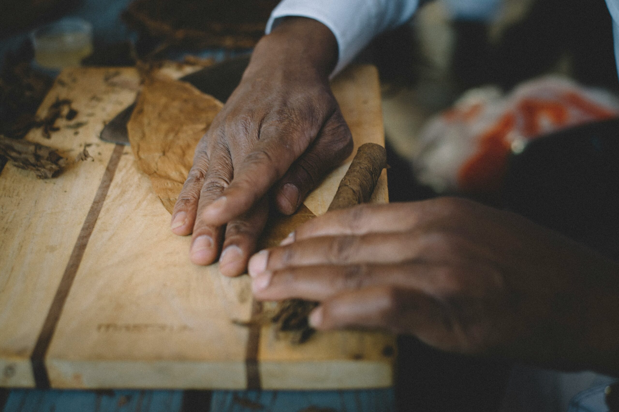 hands rolling a cigar